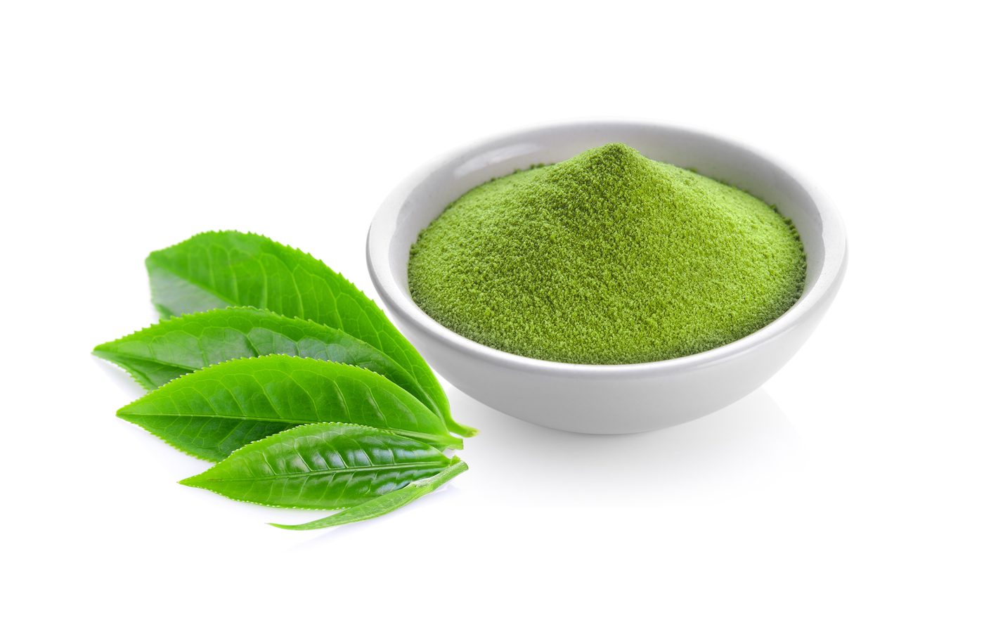 Green botanical powder in a bowl